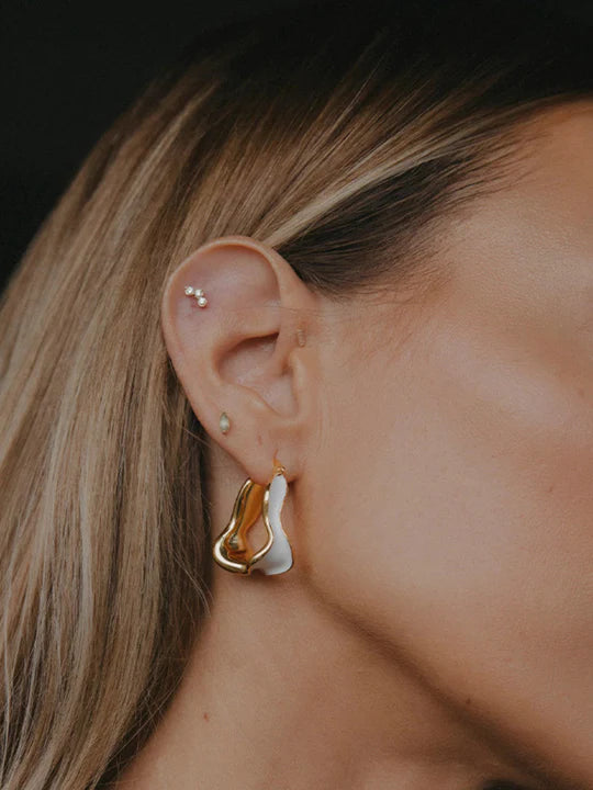 White detailed earring