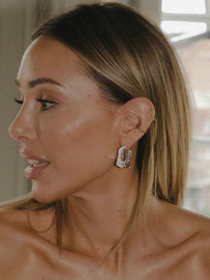 White detailed earring